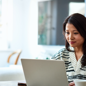 Woman using laptop and working from home