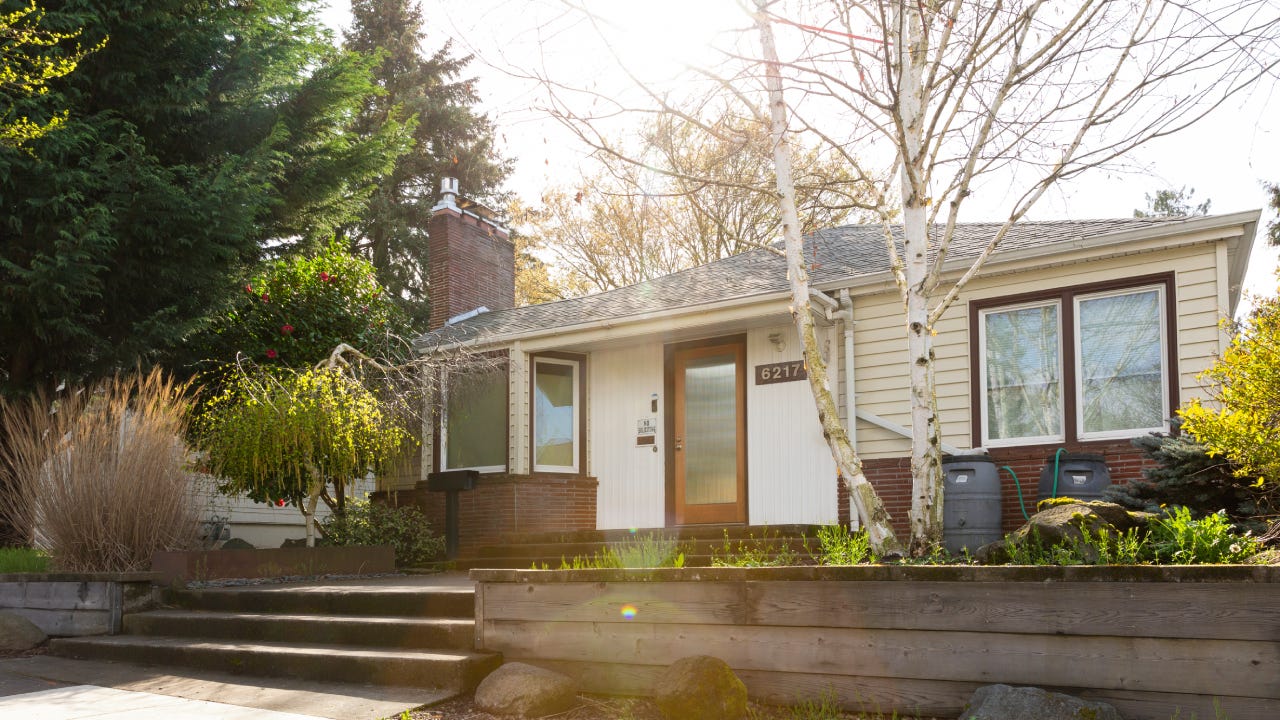 Wide exterior shot of a 1940 style bungalow style house in Portland Oregon.
