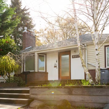 Wide exterior shot of a 1940 style bungalow style house in Portland Oregon.