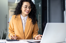 Mature successful financier accountant on paper work with papers, documents contracts and charts graphs, businesswoman boss with calculator smiling happy with achievement results, inside office.