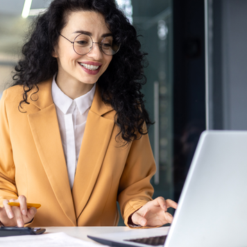 Mature successful financier accountant on paper work with papers, documents contracts and charts graphs, businesswoman boss with calculator smiling happy with achievement results, inside office.