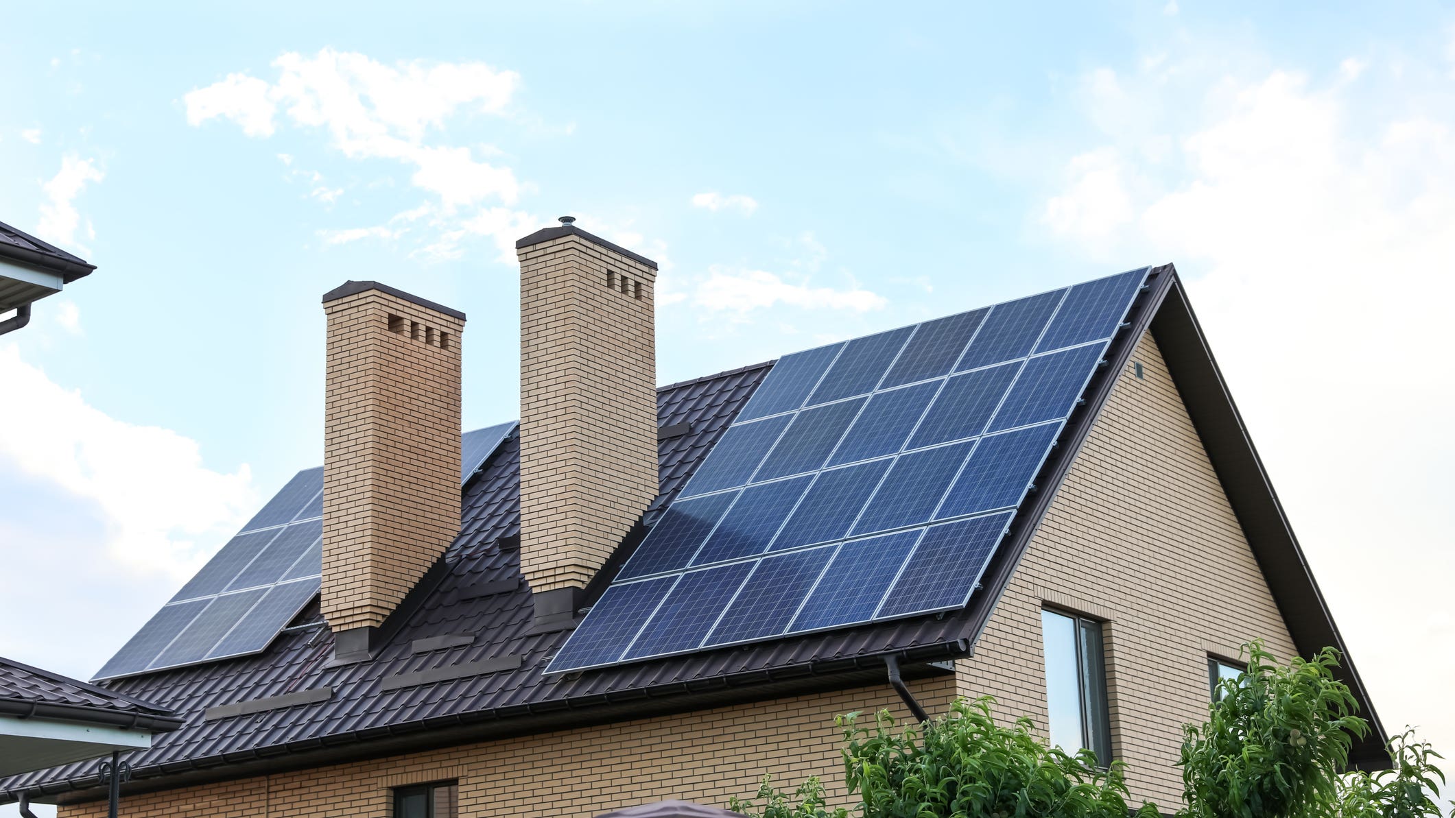 Home with solar panels installed on the roof .