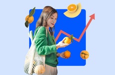 Woman looking at fruit while grocery shopping