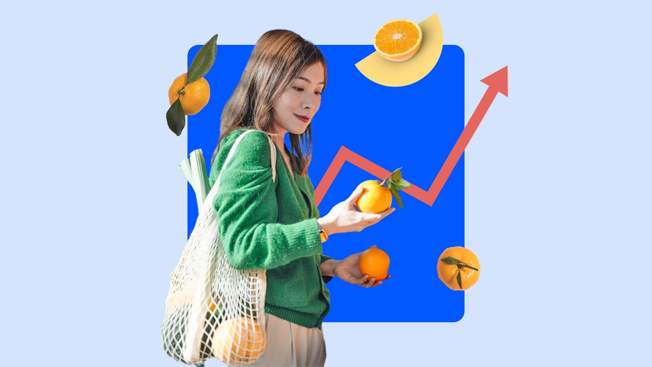 Woman looking at fruit while grocery shopping