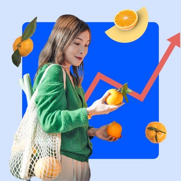 Woman looking at fruit while grocery shopping