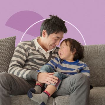 father and son on couch at home