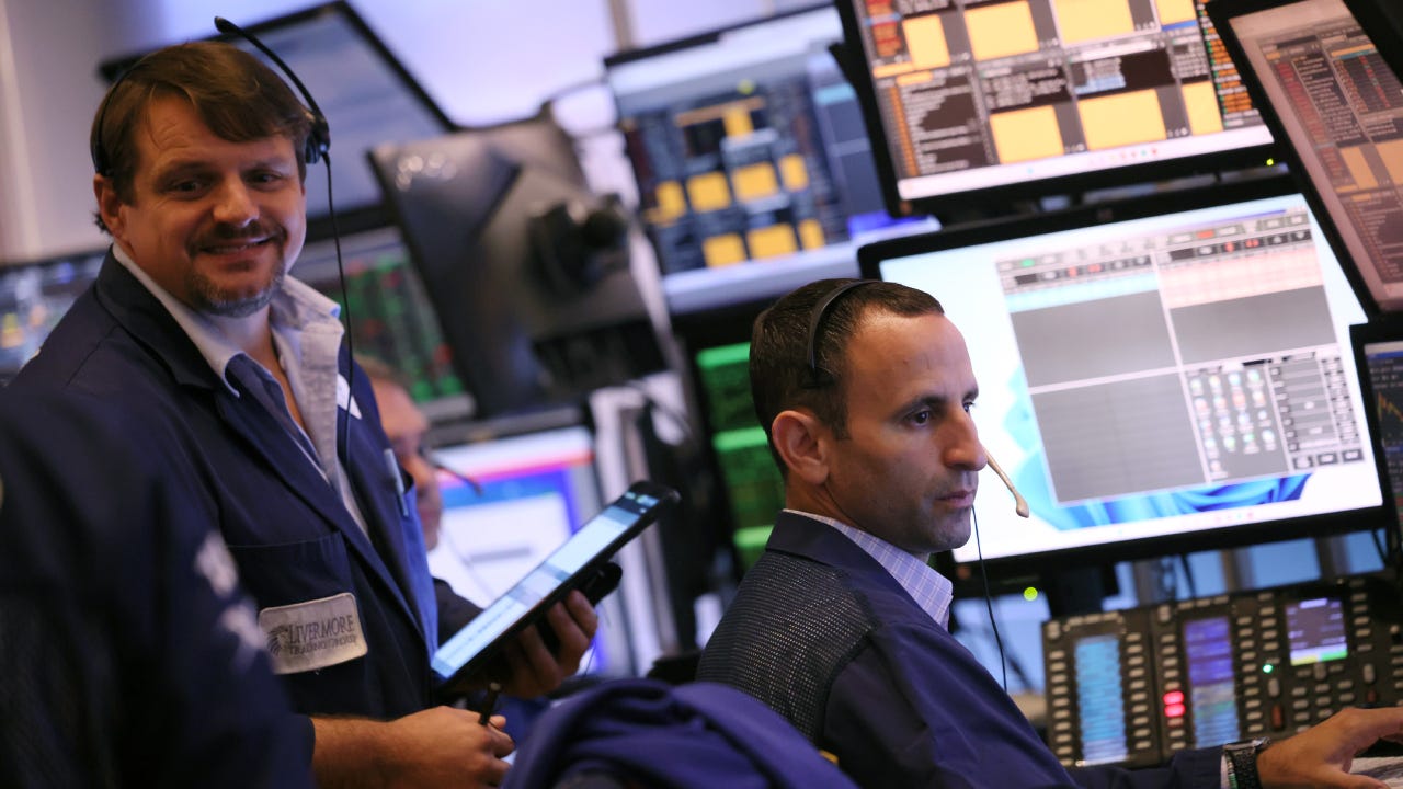 Traders work on the floor of the New York Stock Exchange