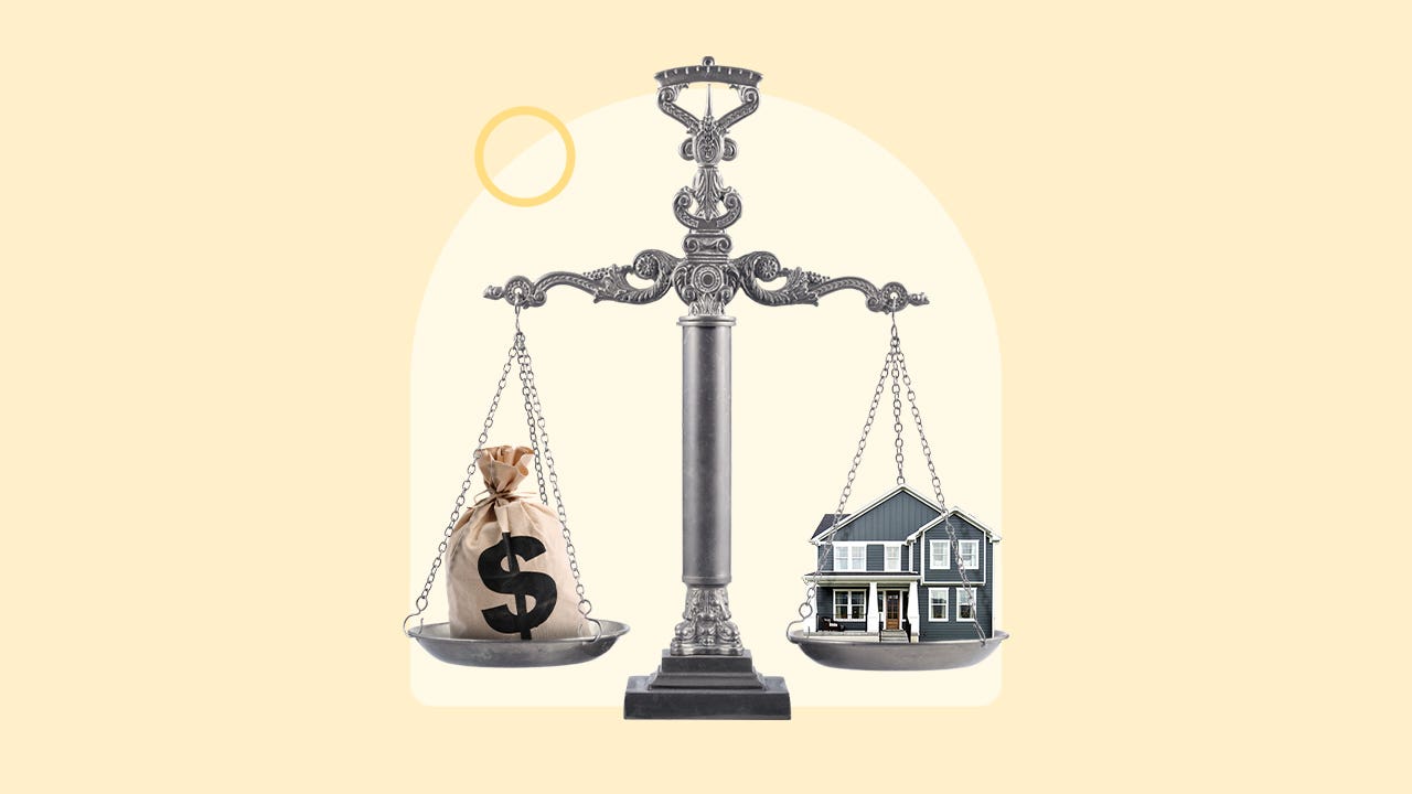 A scale balancing a house and money