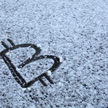 Bitcoin Sign on snow