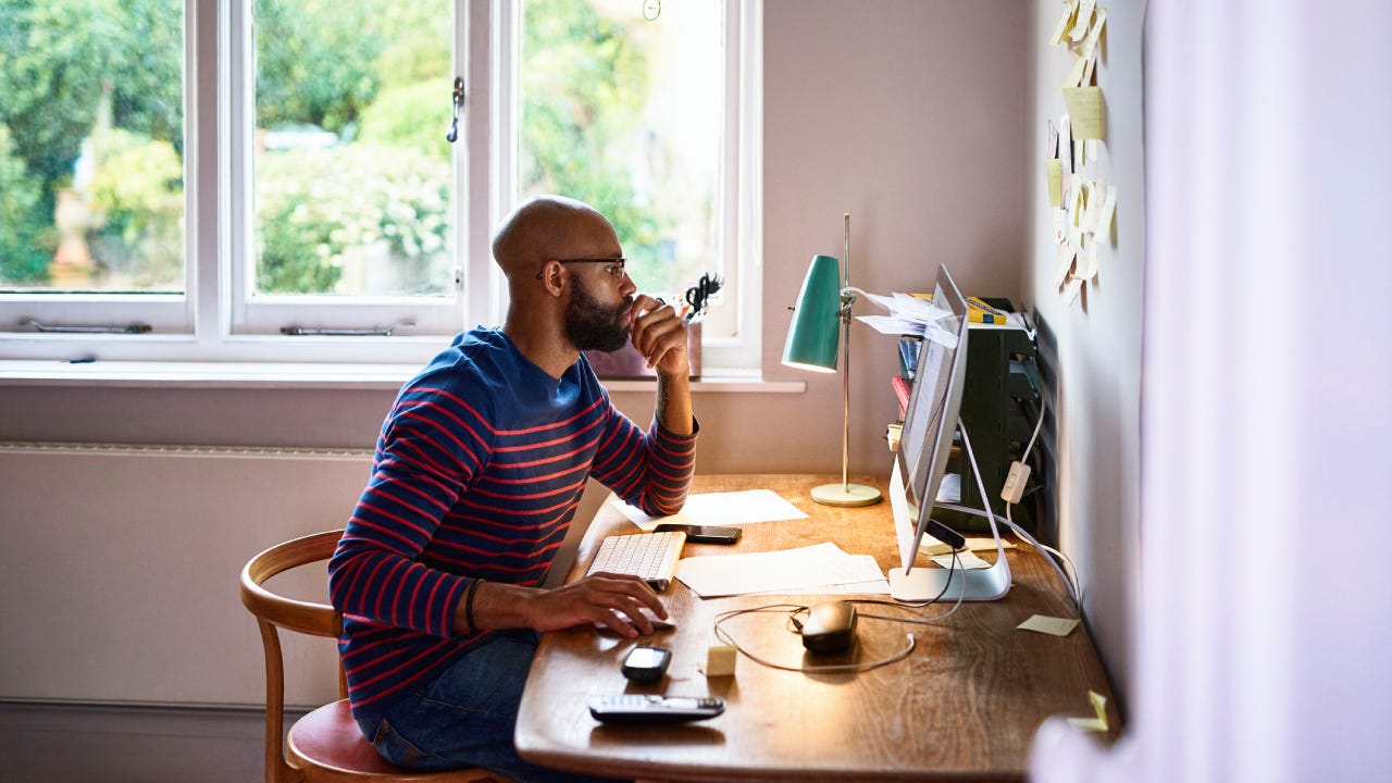 Man using computer in home office