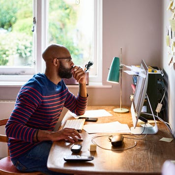 Man using computer in home office