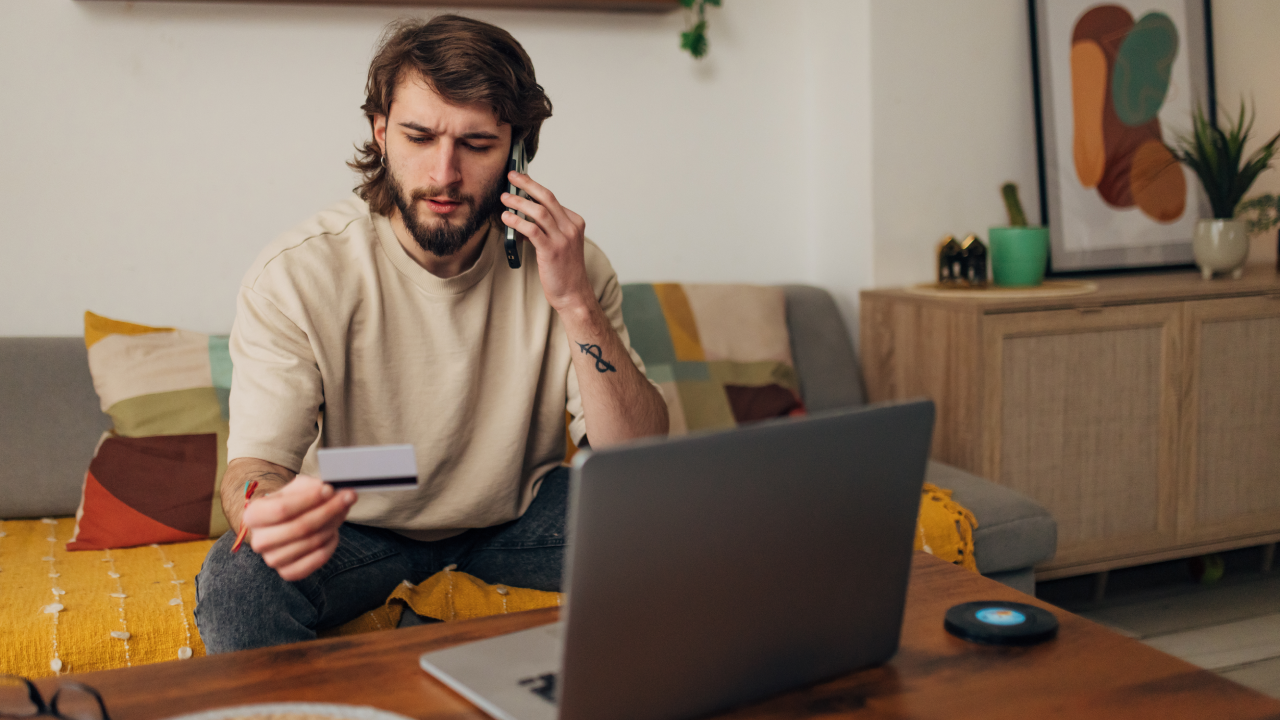 Man having problem with credit card, using mobile phone, dissatisfied male using internet banking service, checking balance, loss money, internet fraud and scam concept