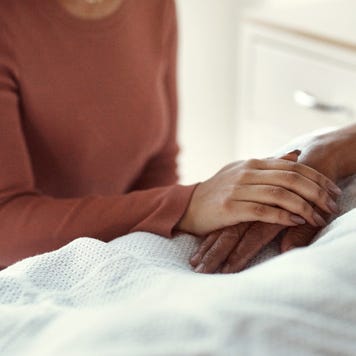 healthcare and support with a woman holding hands with her man in the hospital