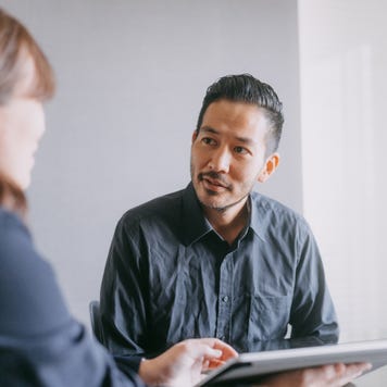 Man meeting banker for financial advice in a meeting room