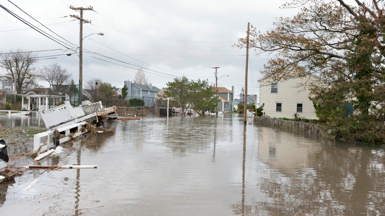 Damaged houses and flooded streets after Hurricane Sandy