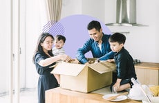 A family unpacking a box together