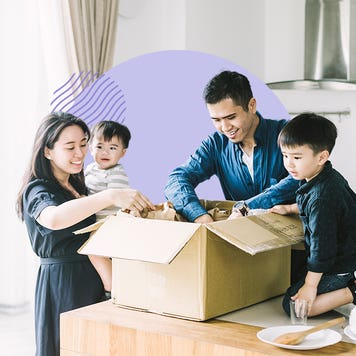 A family unpacking a box together