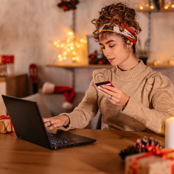 young woman shopping online at home during Christmas holidays