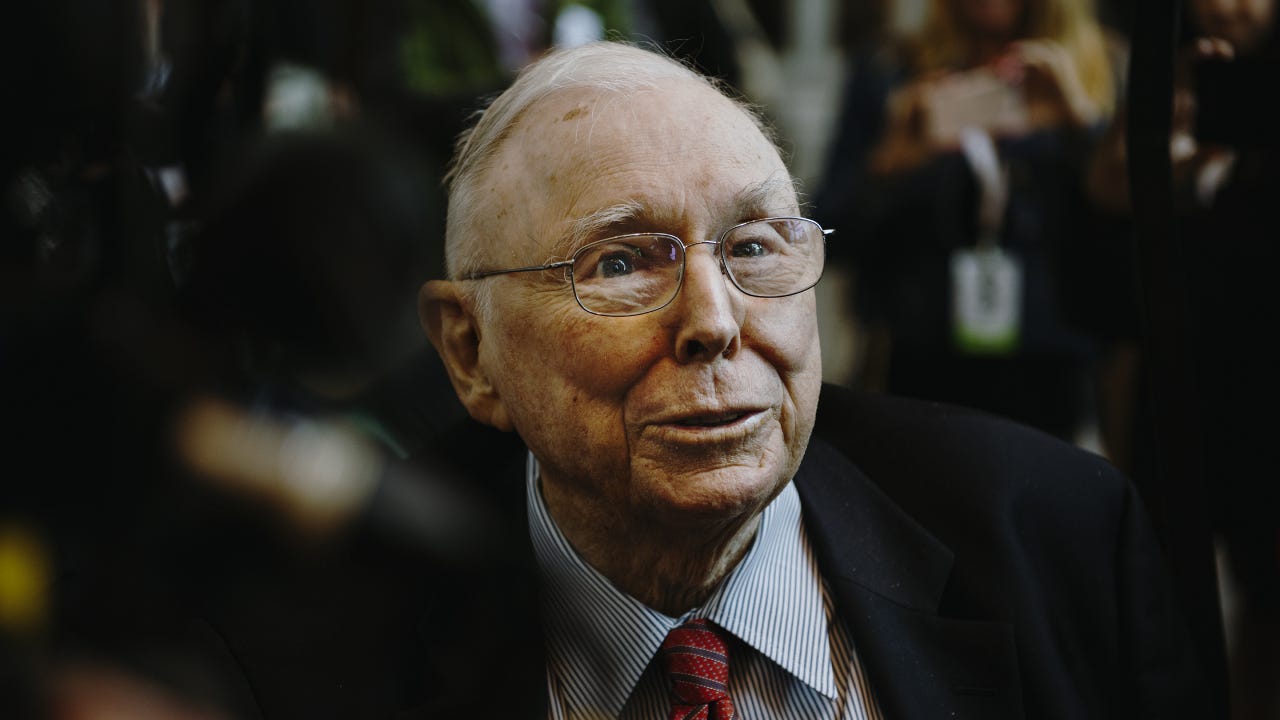 Charlie Munger, vice chairman of Berkshire Hathaway Inc., speaks to members of the media