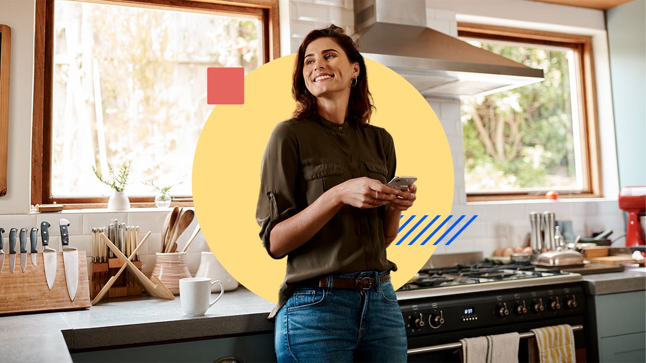 woman at home in kitchen with mobile phone, photo illustration