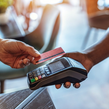 NFC Technology. Man giving credit card to waiter using modern contactless system at the bar