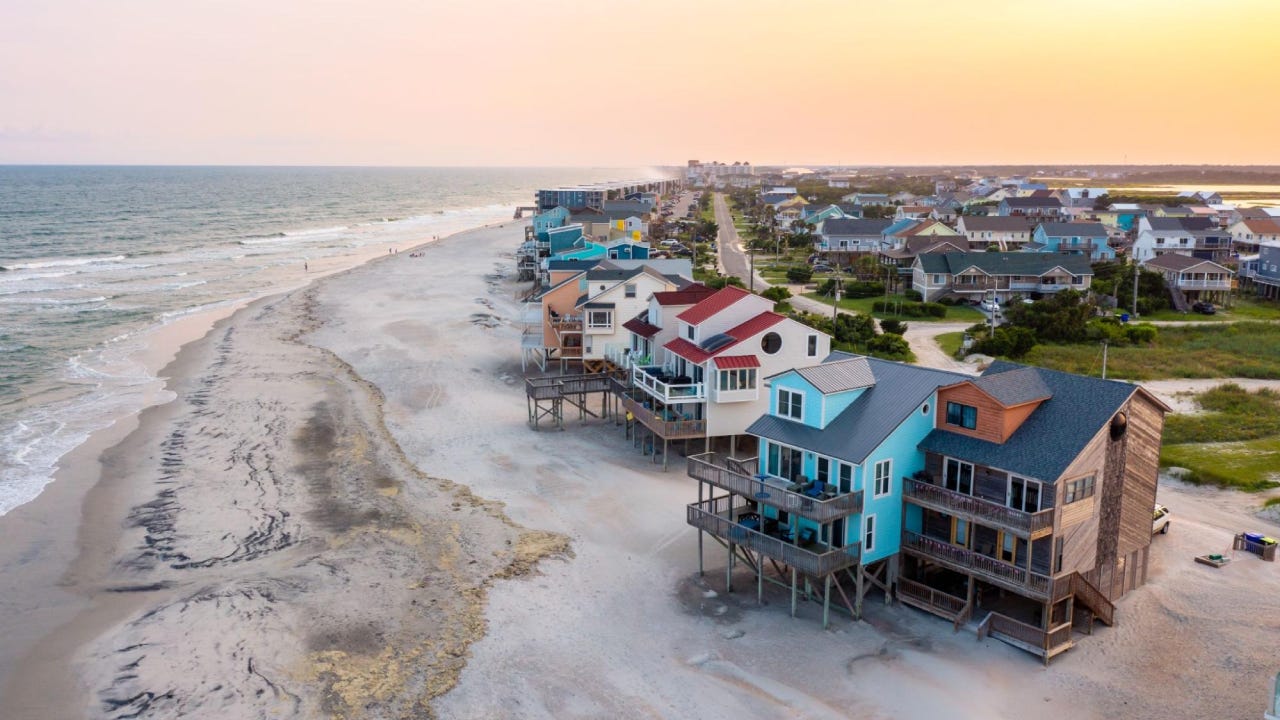 Shot of a coastal neighborhood against a twilight sky.