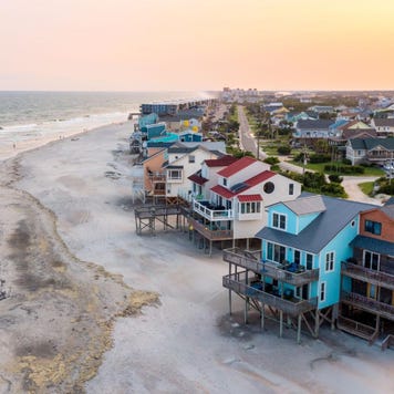 Shot of a coastal neighborhood against a twilight sky.