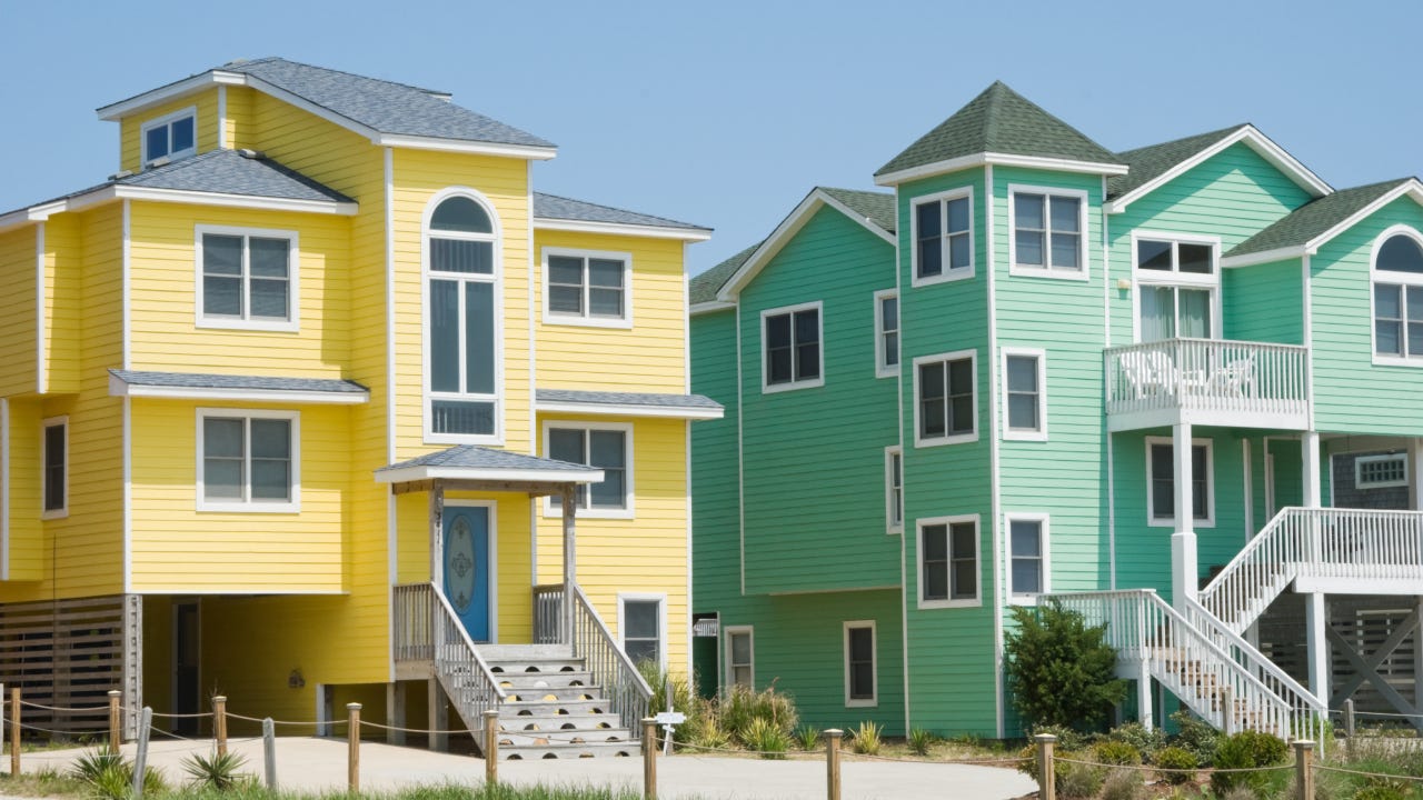 Beach houses in unusual bright colors at a summer seaside resort