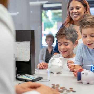 Mom teaching her sons about financial responsibility