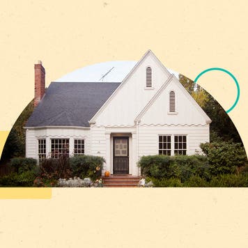 A white house with two prominent triangle roof peaks