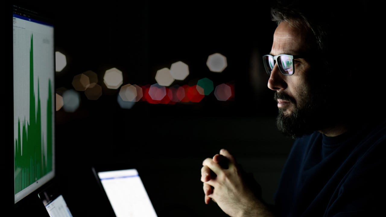 Currency trader from his home office