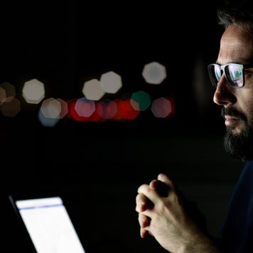 Currency trader from his home office
