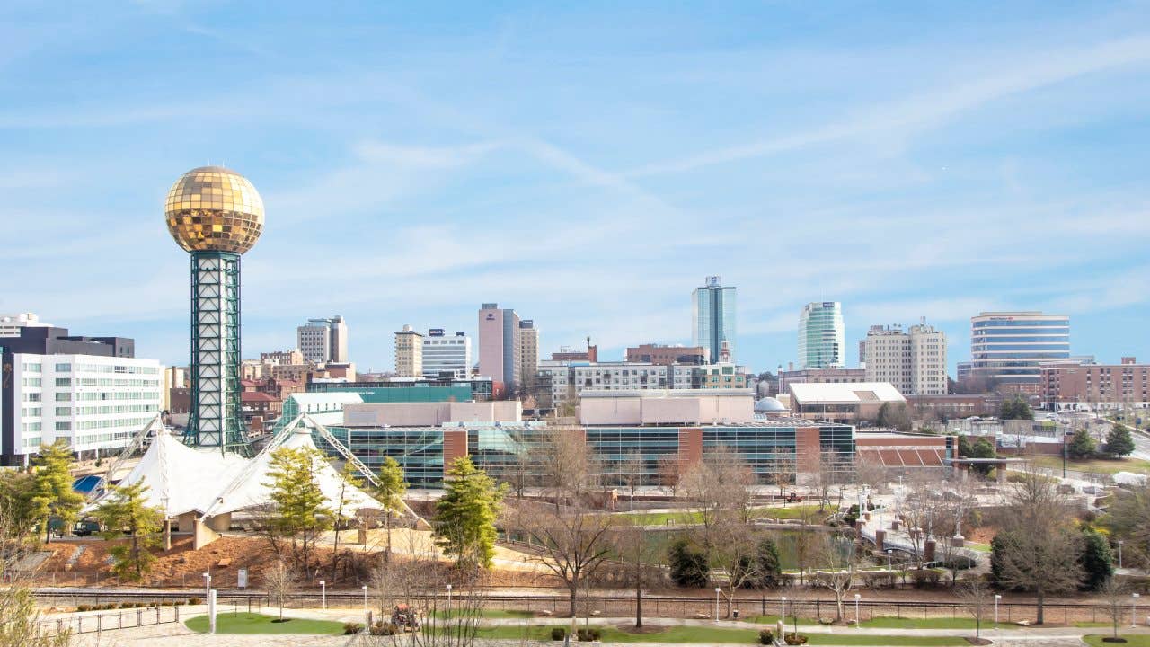 Skyline of Knoxville, Tennessee was captured from an elevated position. The iconic Sunsphere tower is on the left side of the composition with the rest of the skyline stretching to the right.
