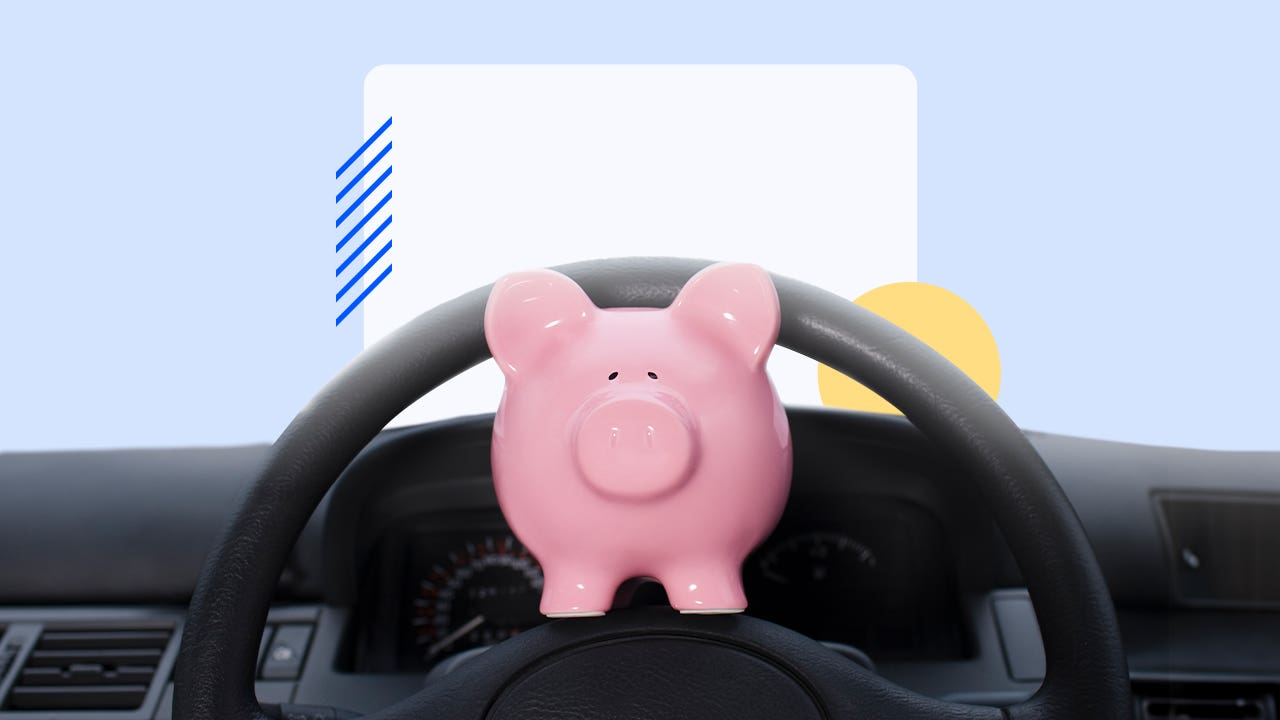 piggy bank on a steering wheel