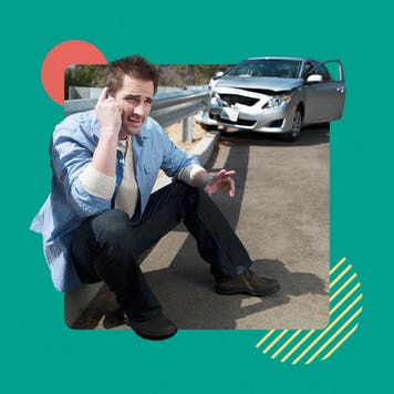 Driver sitting by the side of the road on the phone a few yards from their totaled car