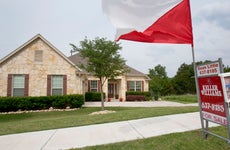 A flag flies outside a home for sale through Keller Williams