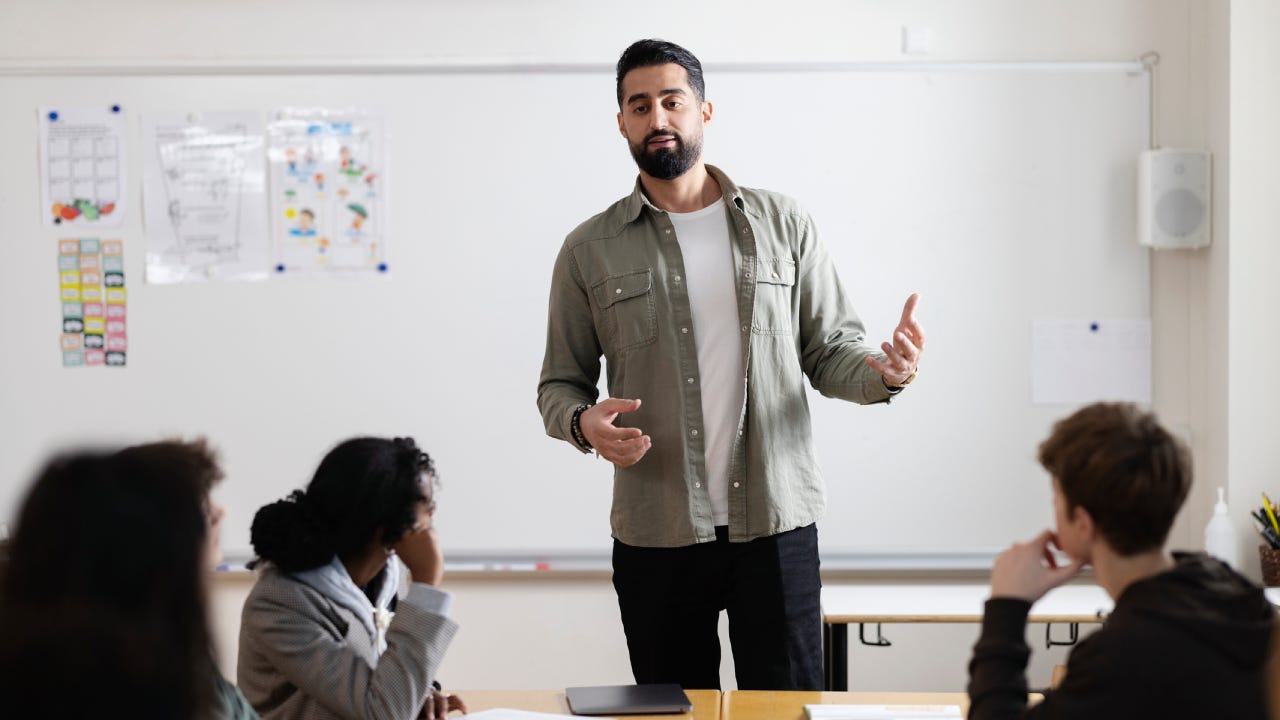 Teacher working in school classroom