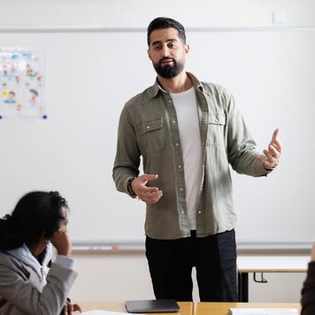 Teacher working in school classroom