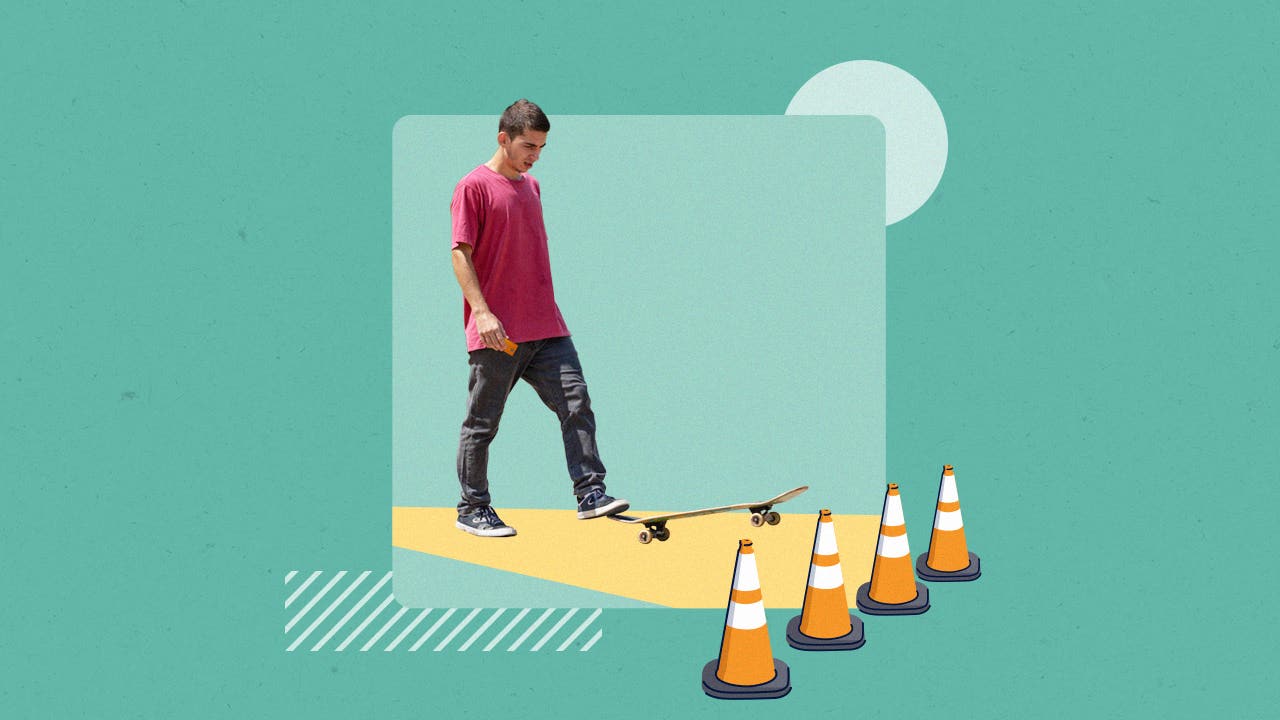 A person on a skateboard, heading toward a roadblock