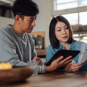 couple planning home finance with digital tablet