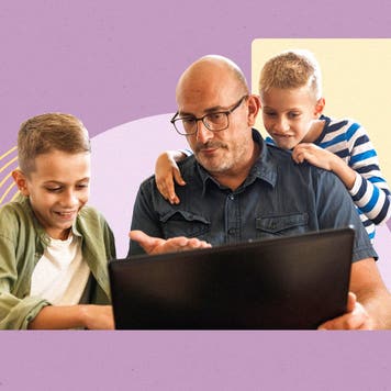 A parent sitting in front of a laptop with their kids