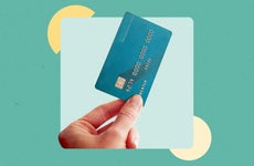 design element of a hand holding a credit card