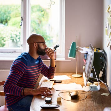 Man using computer in home office