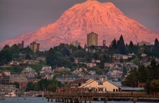 The famous Mount Rainier looms over Tacoma, WA at sunset