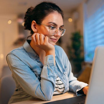 woman, using laptop while working from home