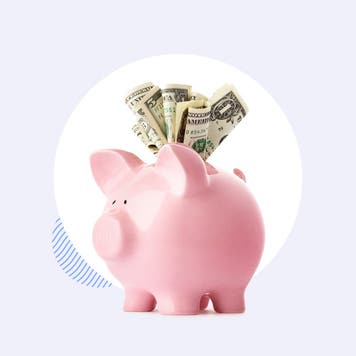 Piggy bank with cash overflowing