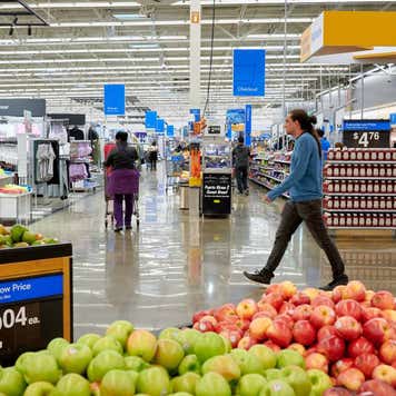 Man walking through Walmart produce section