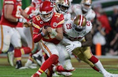 Patrick Mahomes #15 of the Kansas City Chiefs is tackled by Jaquiski Tartt #29 of the San Francisco 49ers