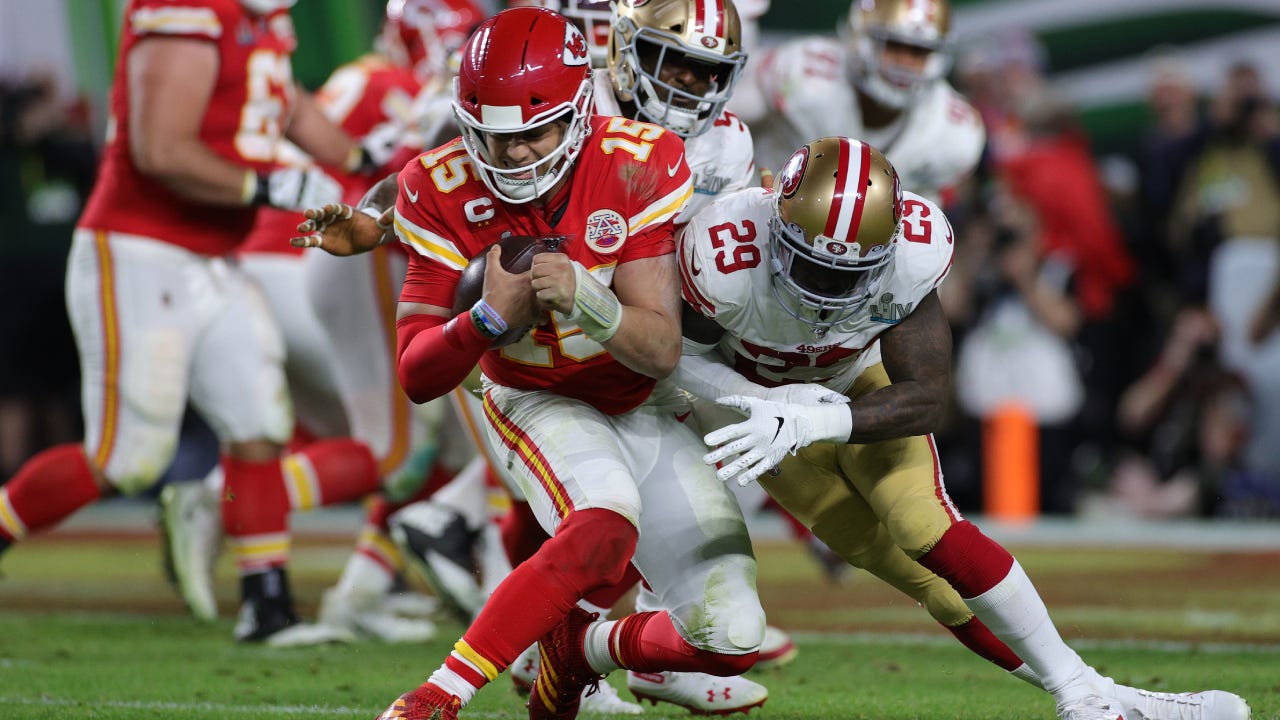 Patrick Mahomes #15 of the Kansas City Chiefs is tackled by Jaquiski Tartt #29 of the San Francisco 49ers