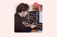 Man using a desktop computer to do financial transactions